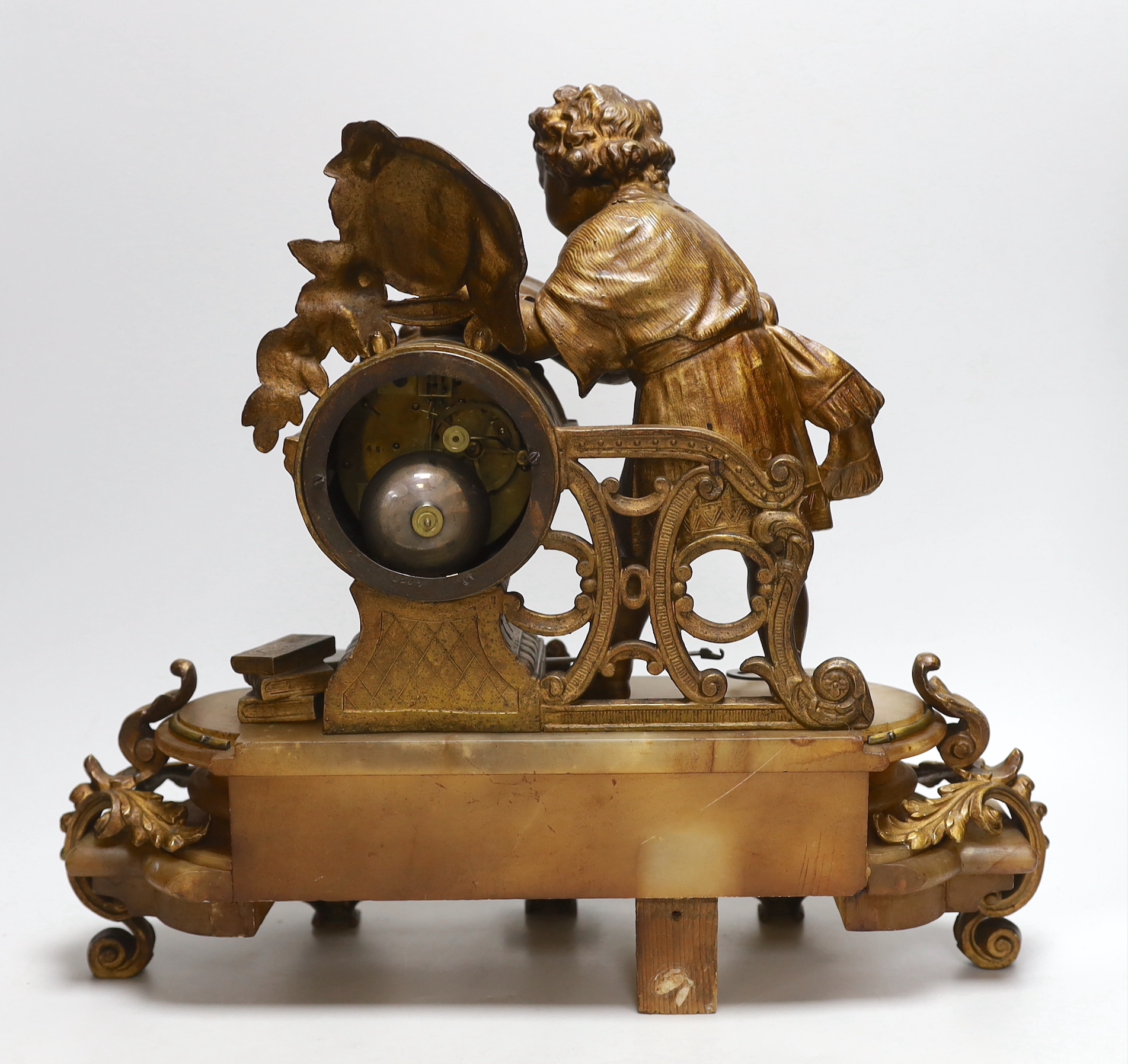 A French bronze and onyx mantel clock by Japy Frere with figure of a child reading, striking on a bell, height 38cm
